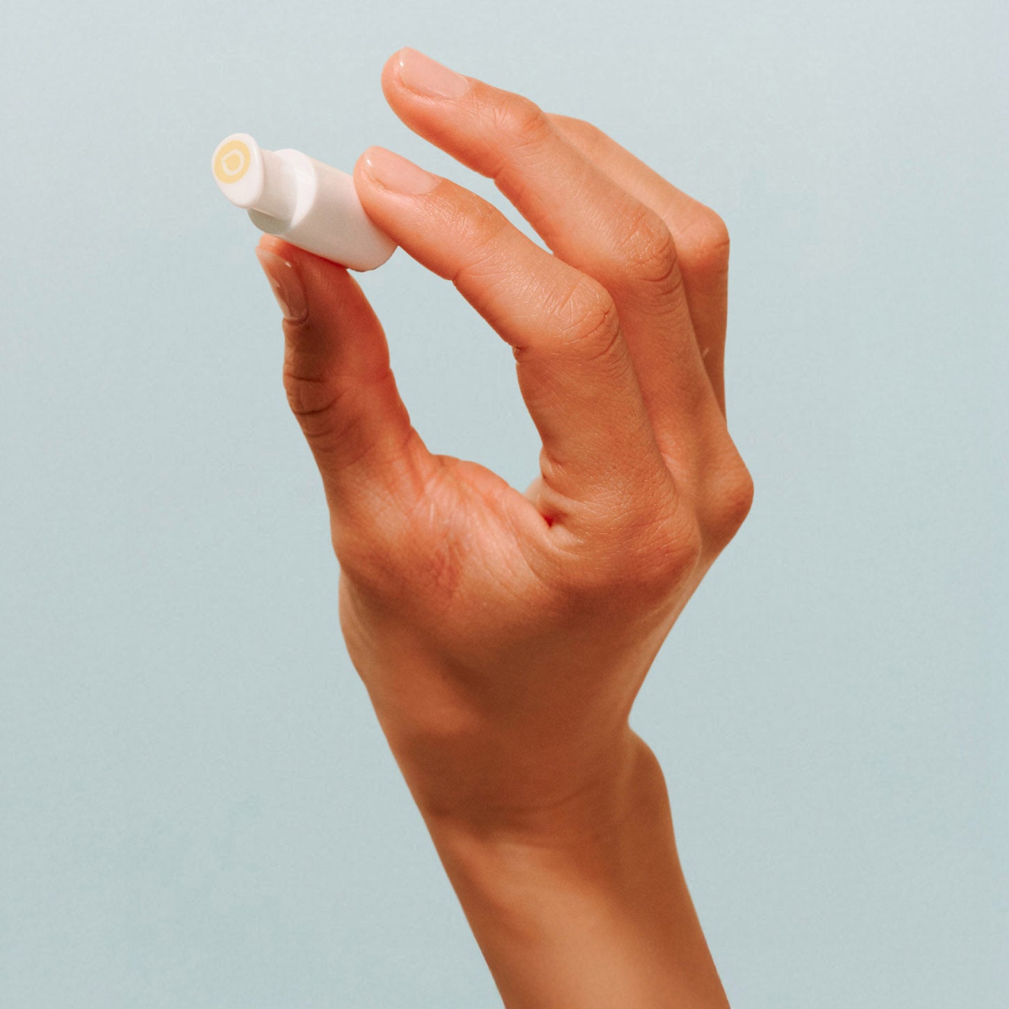 hand holding droplette capsule